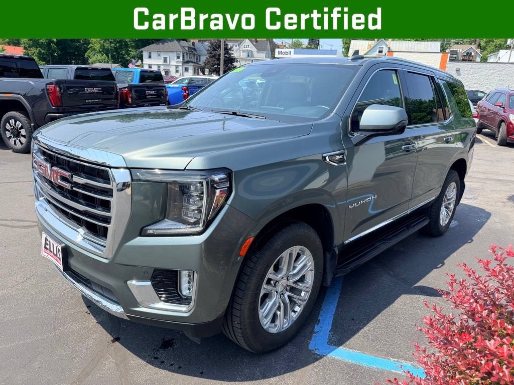 2024 GMC Yukon SLT in Frosted Pine Metallic — front three-quarter view